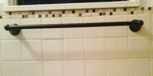 Large towel rack installation on porcelain tile in Torrance